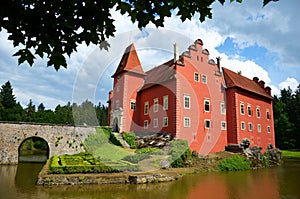 romantic red castle with bridge and lake