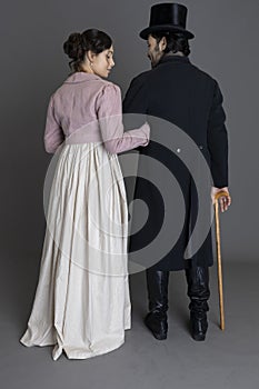 A romantic Regency couple against a grey backdrop