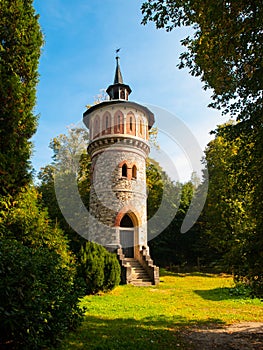 Romantic rounded waterworks tower in the park near Sychrov Castle, Czech Republic, Europe photo