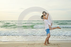 Romantic scene of couple lover on the beach at sunset. Love, wedding and valentine concept