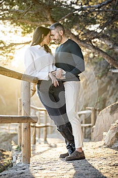 Romantic scene with a heterosexual couple in love looking each other