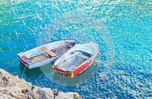 Romantic scene with two rowing boats at sea coast