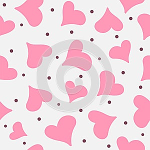 Romantic seamless pattern with randomly scattered hearts and dots.