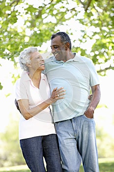 Romantic Senior African American Couple Walking In Park