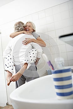 Romantic Senior Couple In Bathroom