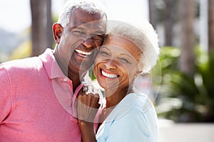 Romantic Senior Couple Hugging In Street