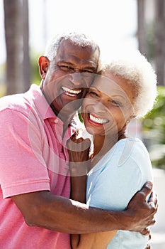 Romantic Senior Couple Hugging In Street