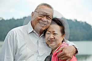 Romantic senior couple on lake