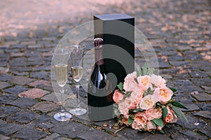 romantic set champagne flowers wine glasses outside