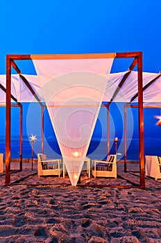 Romantic set up dinner on the beach, twilight time