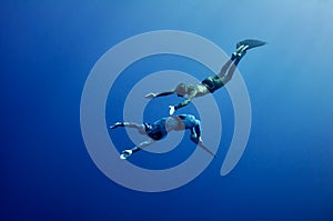 The romantic simultaneous freedive into the depth photo