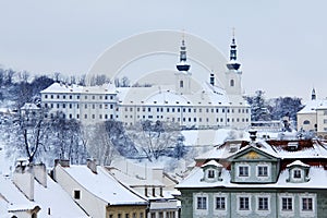 Romantic snowy Prague Roofs with Strahov Monastery