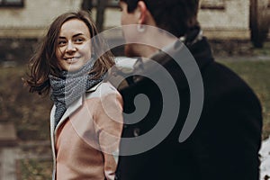 Romantic stylish couple walking and laughing in autumn park. man