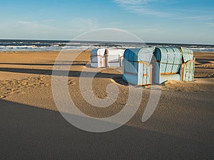 Romantic summer beach with typical  Dutch retro beachchairs in Egmond aan Zee, Netherlands, Europe photo