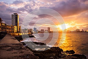 Romantic sunset at the Malecon seawall in Havana