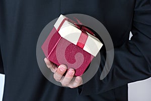 Romantic Surprise: Elegant Man with Red Rose Gift Box
