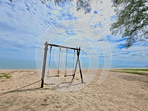 Romantic swings in Samila beach Thailand watching in the morning