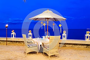 Romantic table set up dinner on the beach