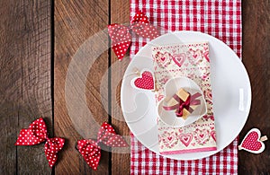 Romantic table setting for Valentines day in a rustic style.