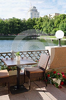 Romantic table in a summer cafe on waterfront photo