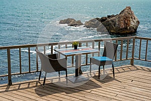 Romantic table for two people on a terrace by the sea