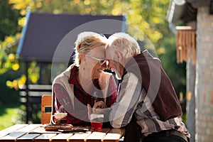 Romantic talk of senior couple in garden photo