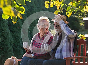 Romantic talk of senior couple in park photo