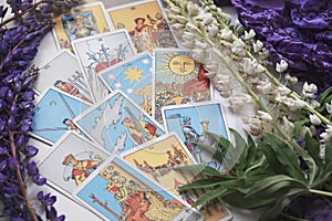 Romantic Tarot Setup Background. Tarot cards and Lupin flowers.