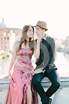 Romantic travel couple in Venice on Gondole ride romance in boat happy together on travel vacation holidays. Romantic young beauti