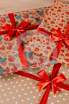 Romantic valentine day gift box for couple in love with heart ornament and red bow and silk ribbon.