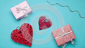Romantic Valentine`s day frame made of romantic accessories on blue background. Stop motion