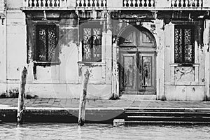 Romantic Venetian nook with vintage wooden door and windows