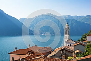 Romantic view on lake como and old church tower in north Italy