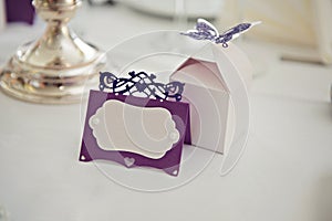 Romantic vintage name sign on the table at wedding reception closeup.