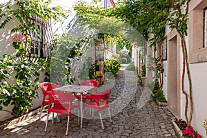 Romantic walkway with small cafe in Ourem fortress and castle town north of Lisbon, Portugal photo