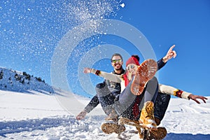 Romantic winter scene, happy young couple having fun on fresh show on winter vacatio, mountain nature landscape