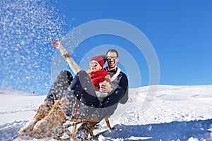 Romantic winter scene, happy young couple having fun on fresh show on winter vacatio, mountain nature landscape