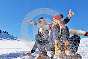 Romantic winter scene, happy young couple having fun on fresh show on winter vacatio, mountain nature landscape