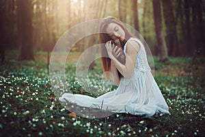 Romantic woman hugging book