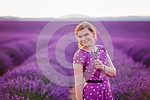 Romantic woman in lavender fields, having vacations in Provence,