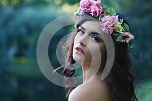 Romantic Woman with Peony Flowers Outdoors