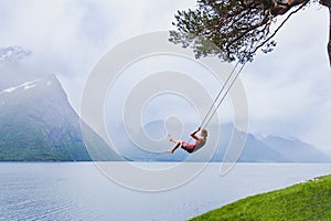 Romantic woman on swing, dream and inspiration