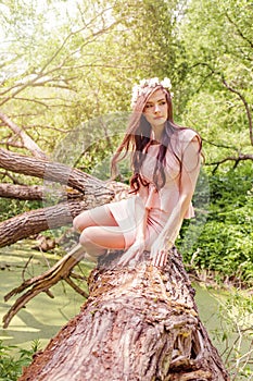 Romantic woman with white flowers in spring park outdoors. Beautiful girl female model outdoor portrait