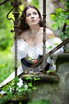 Romantic woman in a white Victorian dress