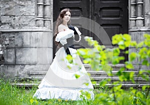 Romantic woman in a white Victorian dress