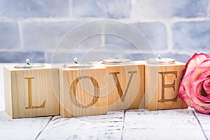 Romantic wooden candle holders with burning tea handles. Valentines day greeting card