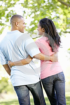 Romantic Young African American Couple Walking In Park