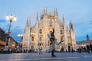 Romantic young couple embracing in front of the Duomo, Milan