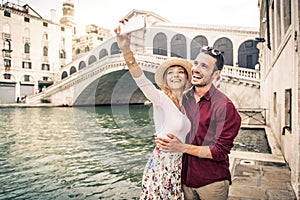 Romantic young couple enjoying vacation in Venice, Italy - Happy tourists visiting Italian city on summer holiday