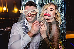 Romantic young couple having fun in the night club.